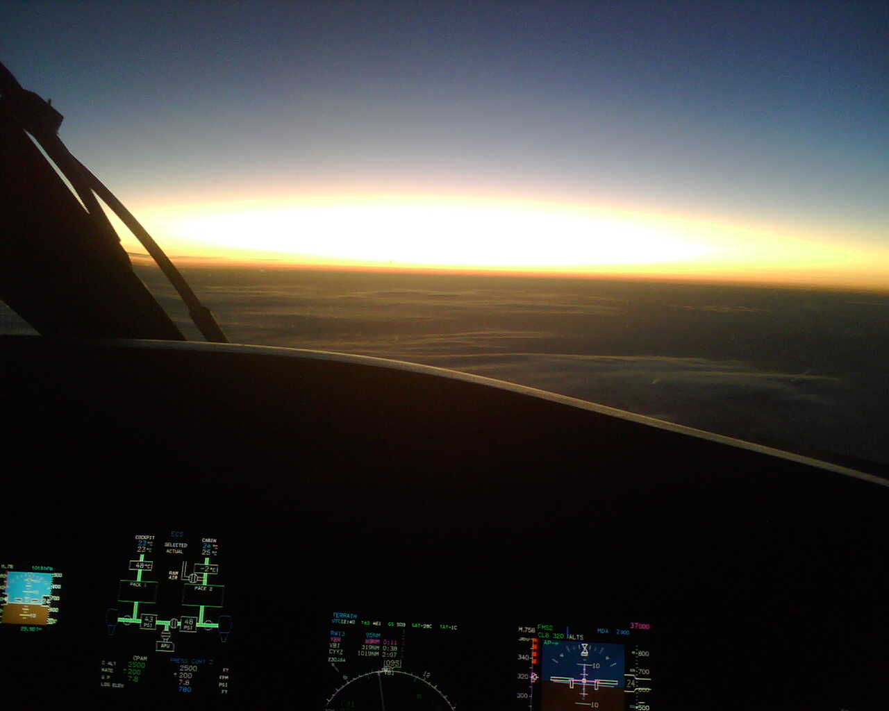 Morning Flight.  Feras Aboulhosn, Langley Flying School Graduate and CRJ 705 Pilot.  Early morning view during flight from Calgary to Toronto.
